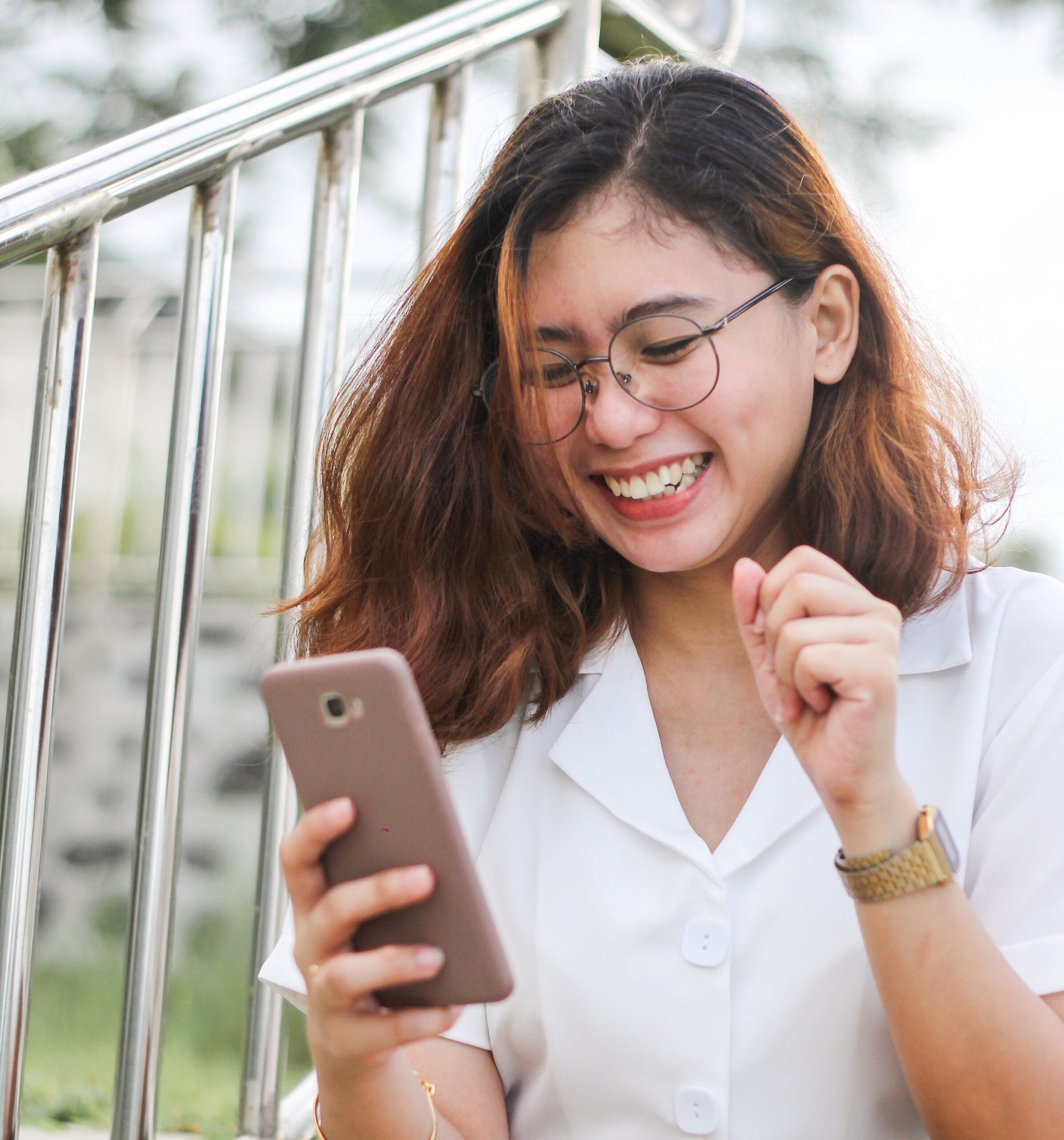 Photo of woman using a SIM card on a phone in Canada.