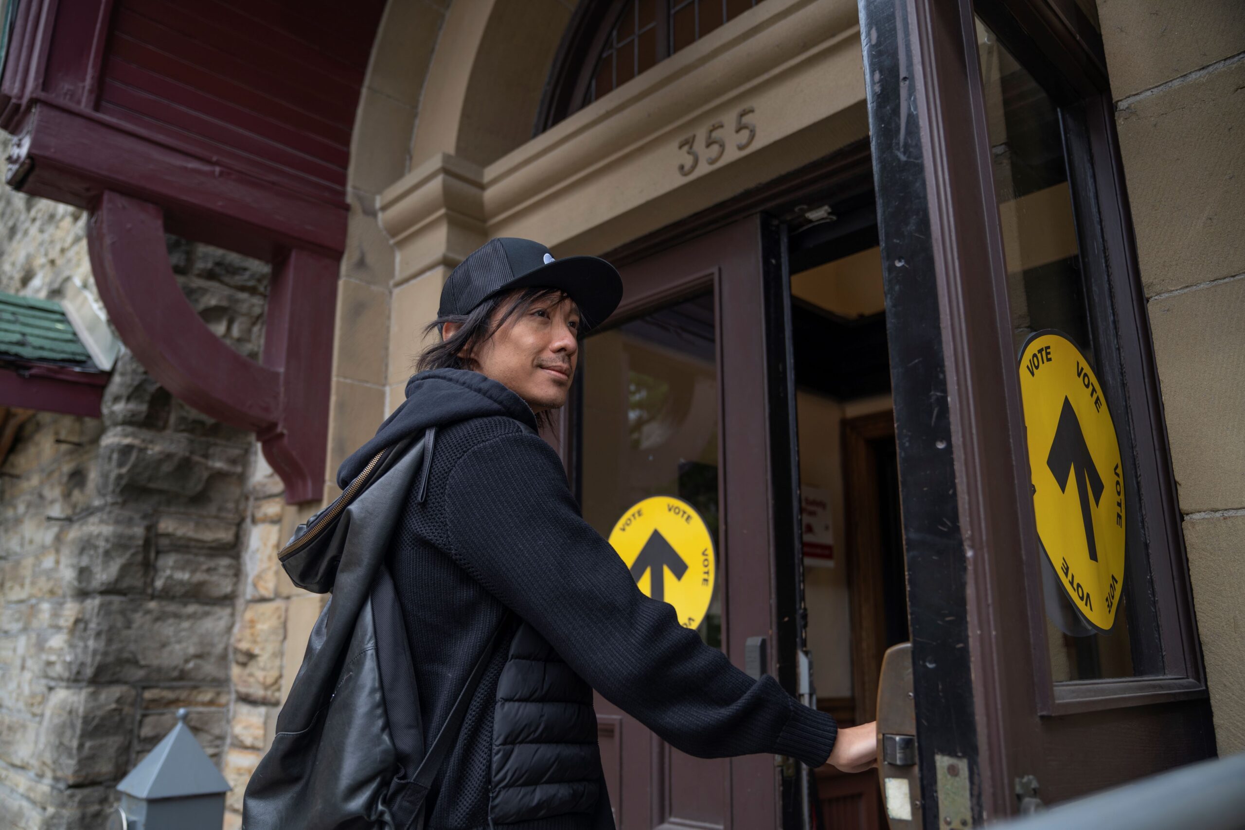 Person entering a polling station to register to vote.