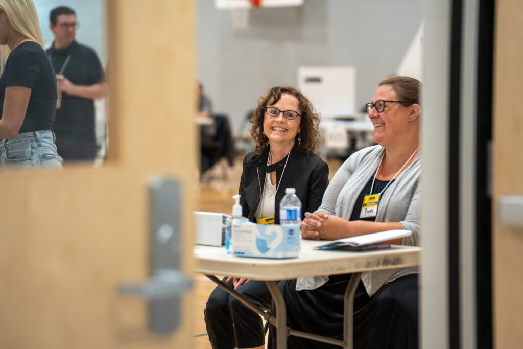 Two women working at a federal election.