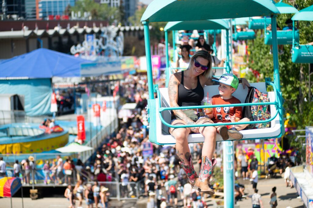 Family enjoying midway rides at the Calgary stampede