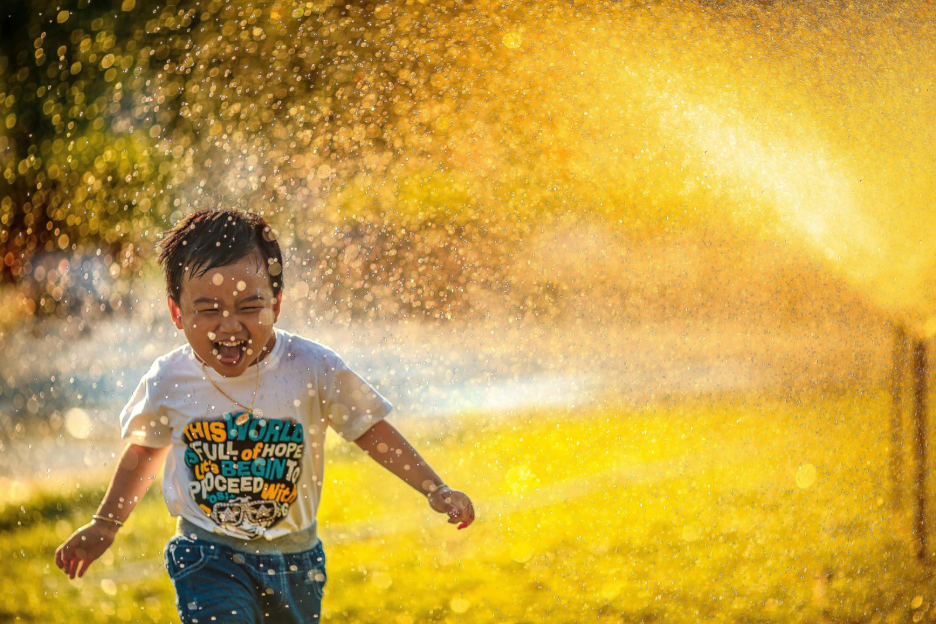 A child playing outside without allergies.