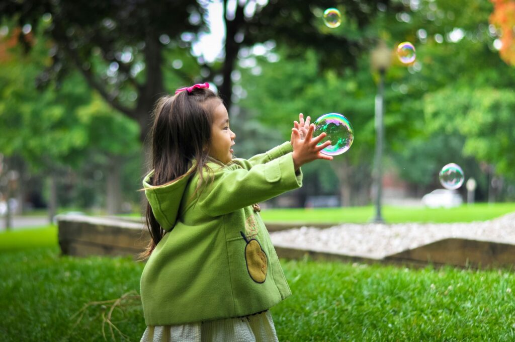 A child without allergies playing outside in the spring.