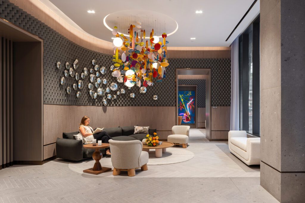 One person sitting on a couch reading.